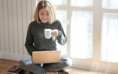 woman-in-gray-sweater-drinking-coffee-3759089